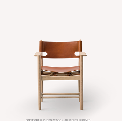 The Spanish Dining Chair With Armrests in Soaped Oak and Cognac Saddle Leather